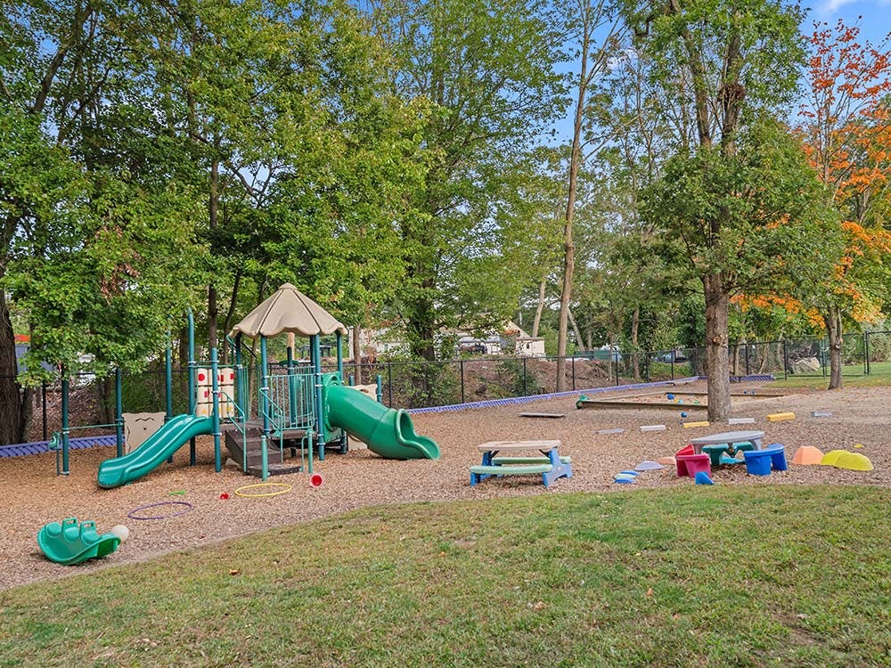 Playground with slides, sandboxes, and small picnic tables