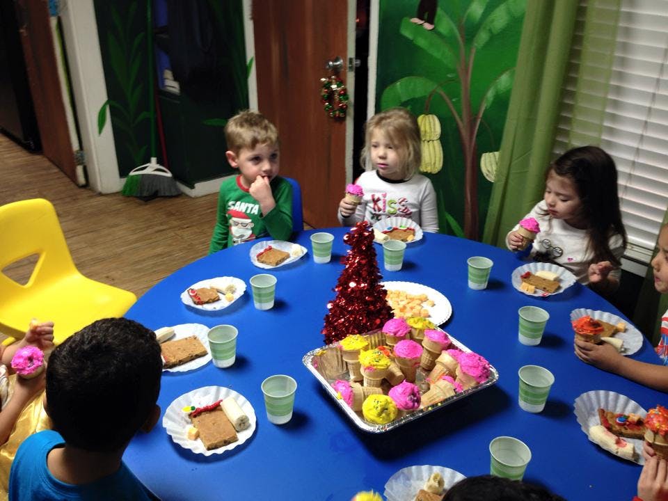 Children eating snacks at a table