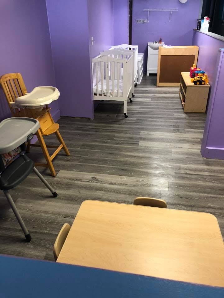 High chairs, cribs, and small tables in a room