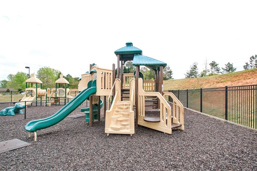 Empty playground with slides and climbing structures