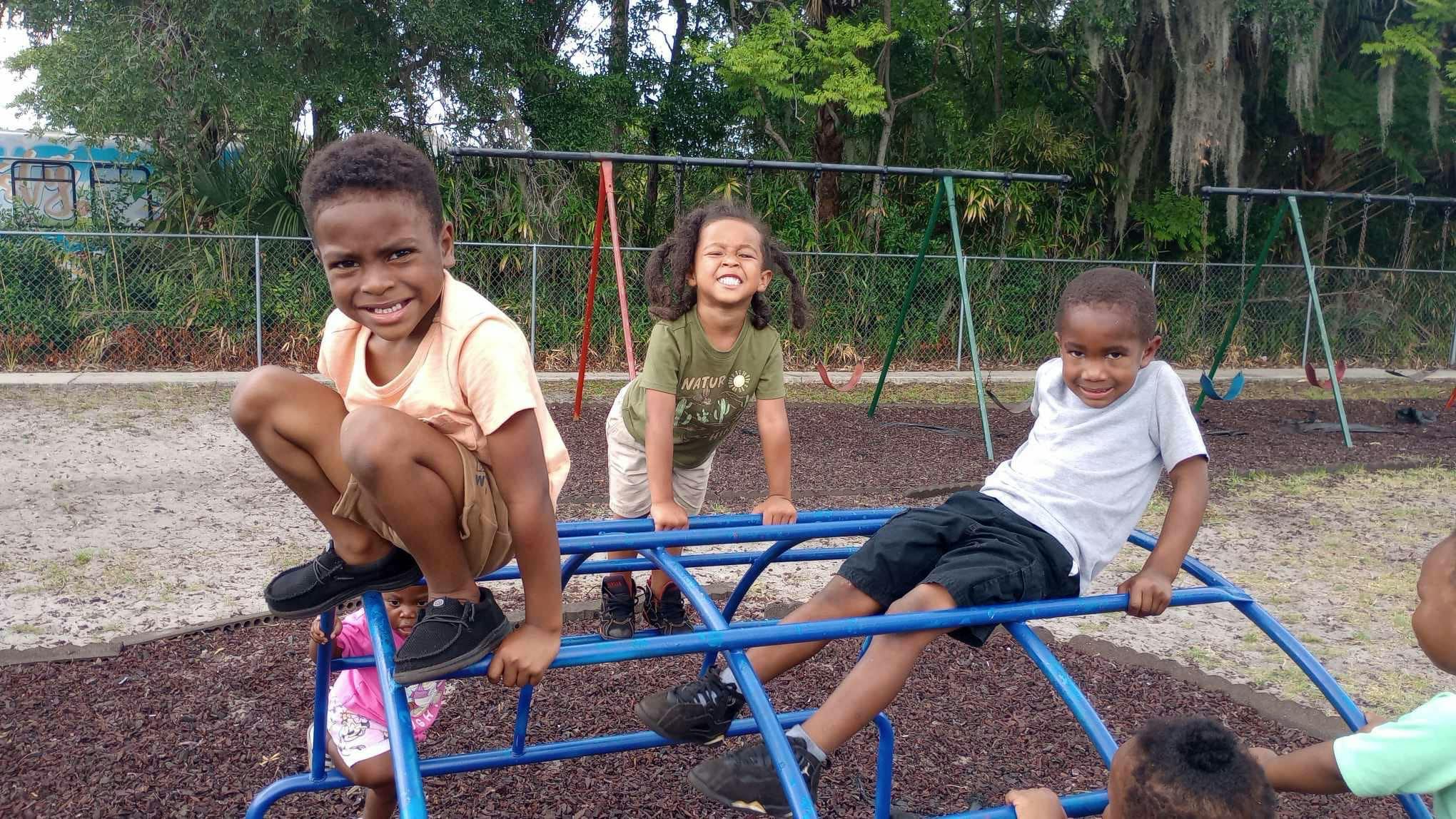 Children playing on a climbing frame at a playground