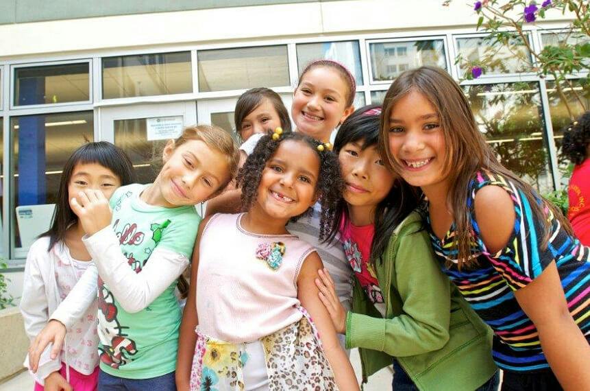 Group of children and teens posing together