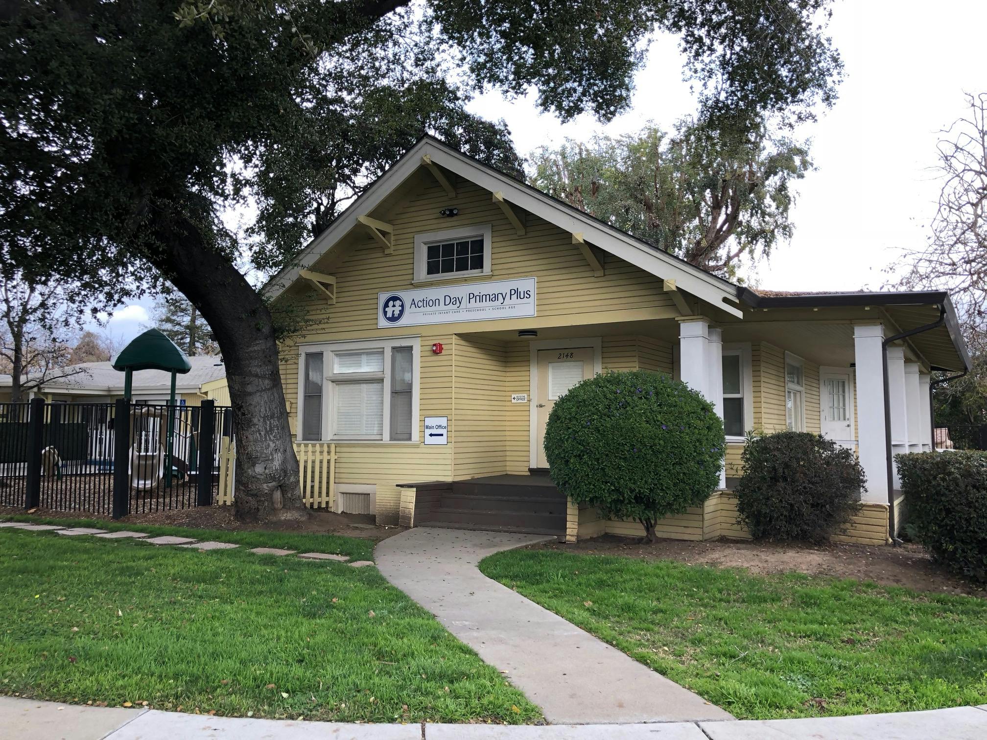 Yellow house with a sign that reads "American River Family Plus"