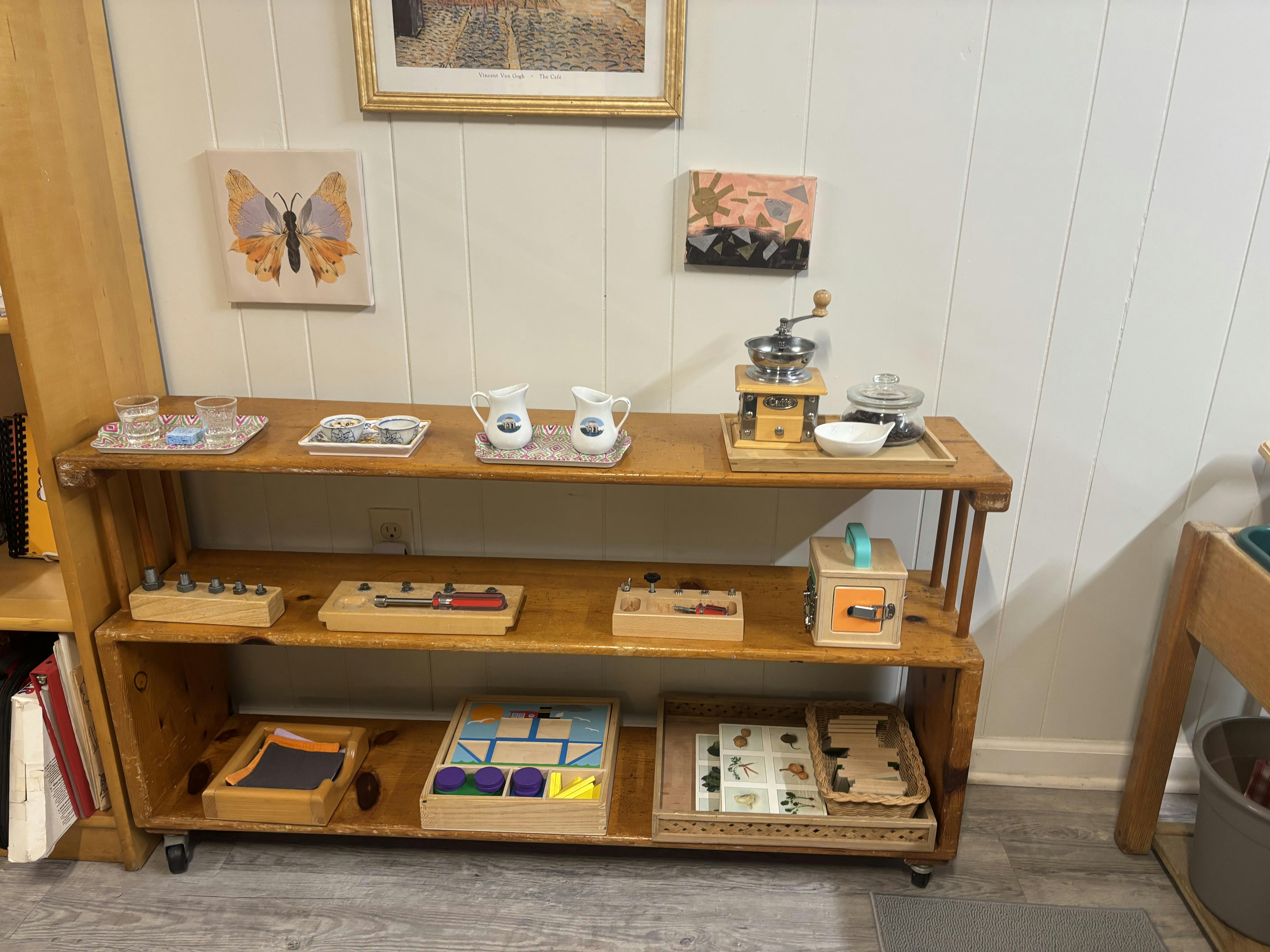 Wooden shelf with various educational toys and activities