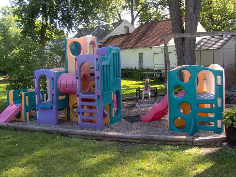 Colorful plastic playground structure with slides and tunnels