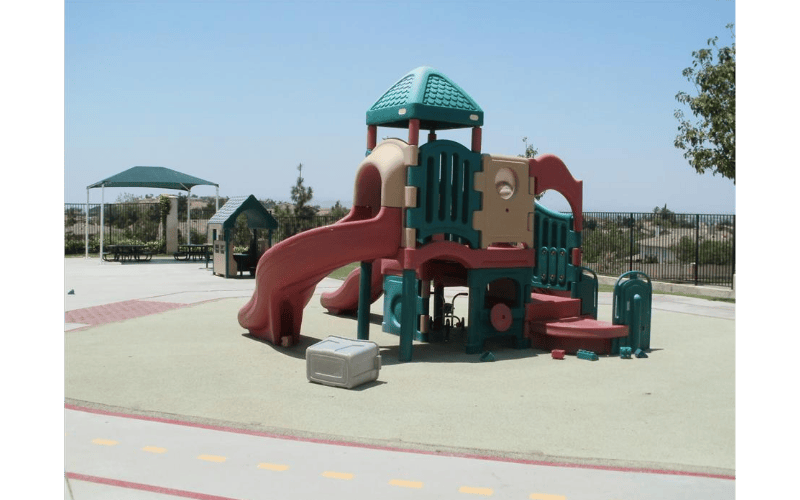 Colorful plastic playground structure with slides and climbing areas