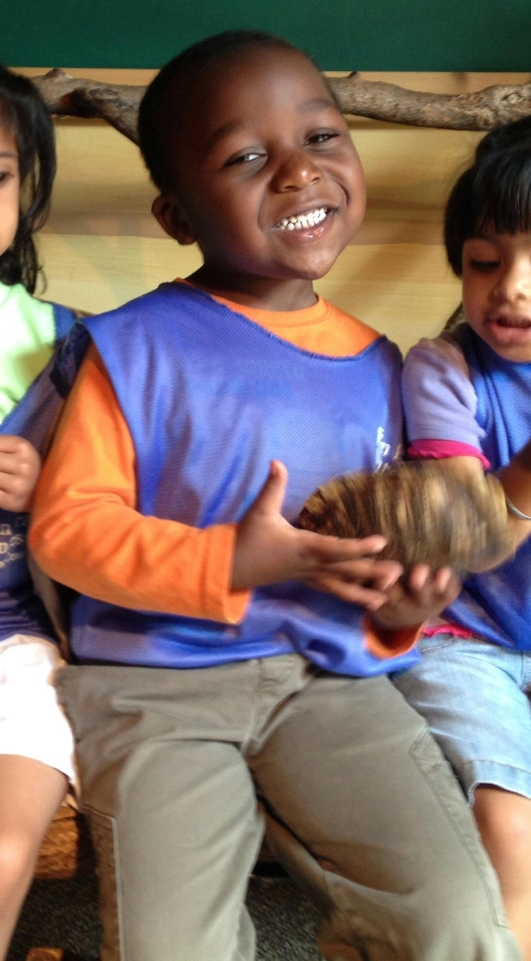 Child holding a turtle