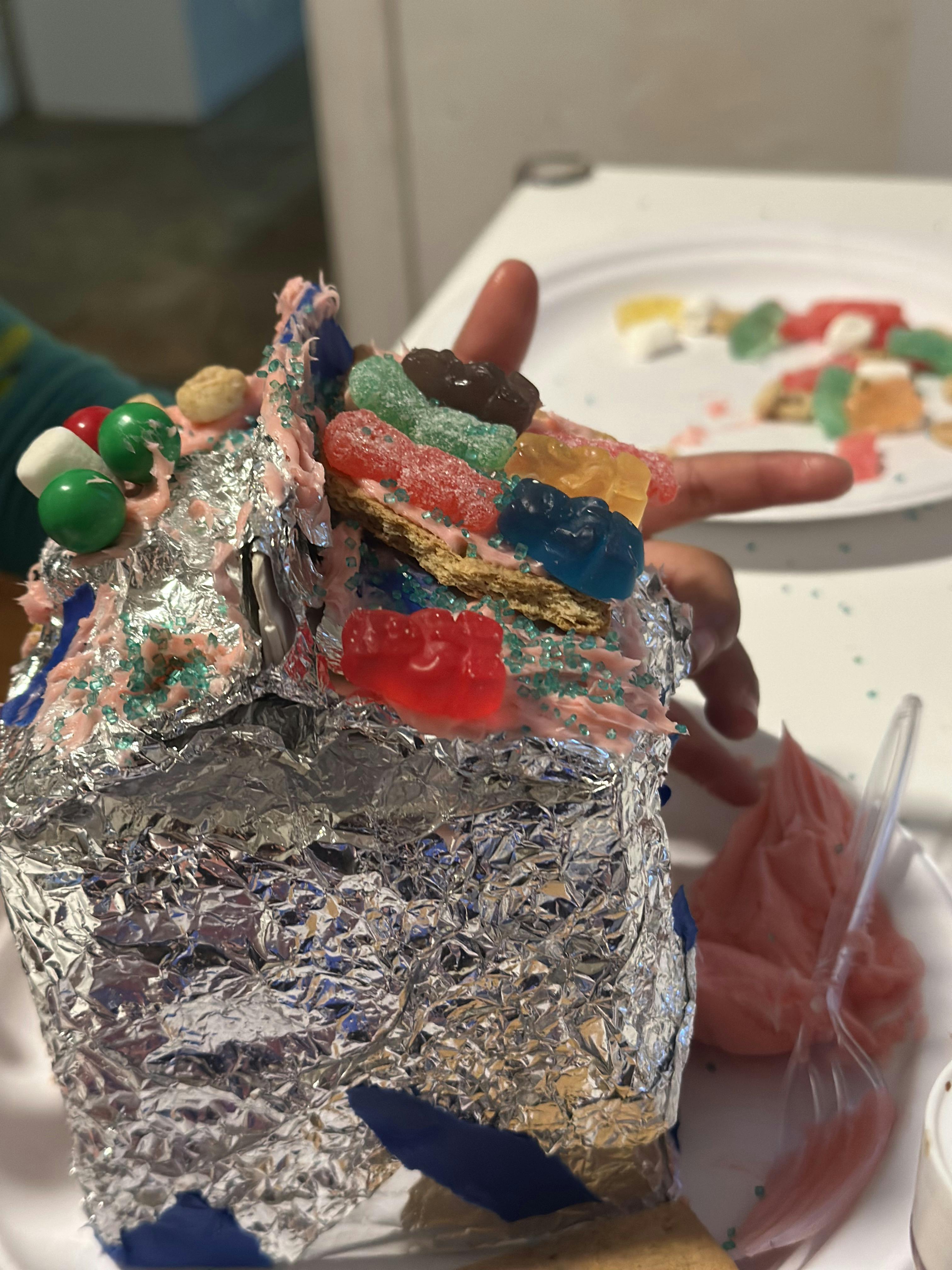 Gingerbread house decorated with colorful candies and icing