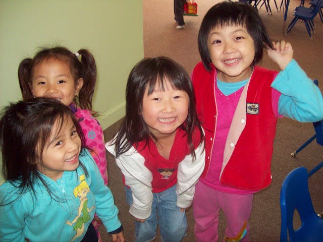 Four children posing together