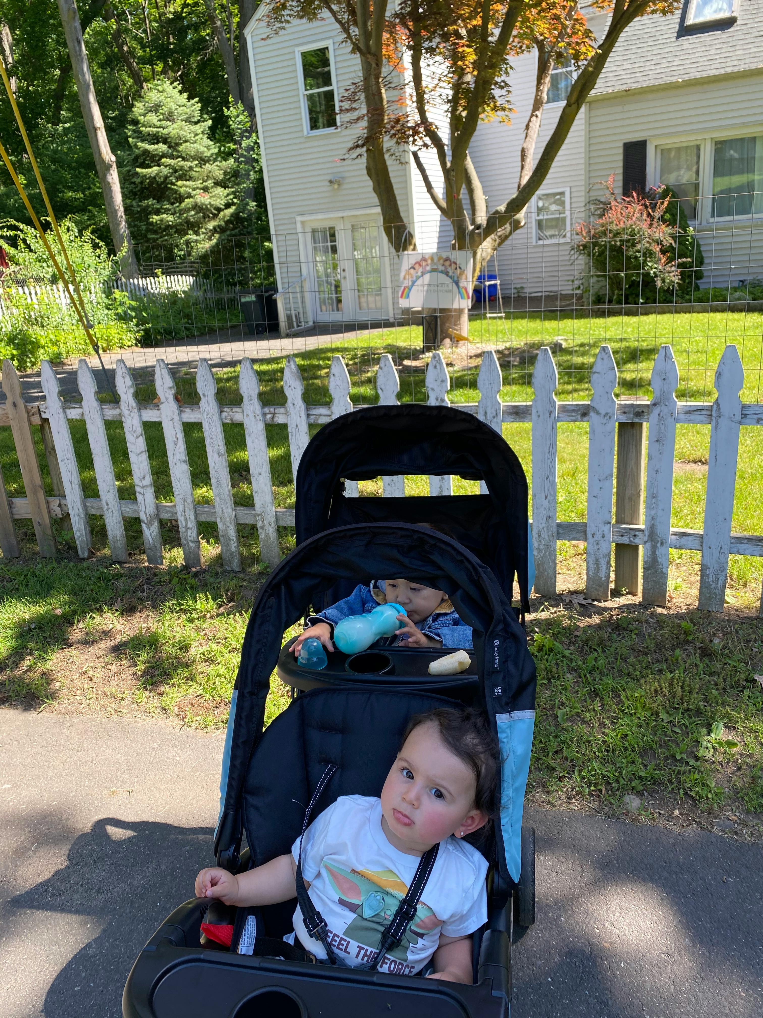 Two children in a double stroller