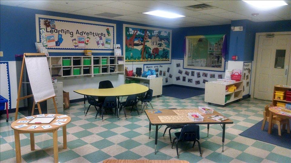 Classroom with child-sized furniture and learning decorations