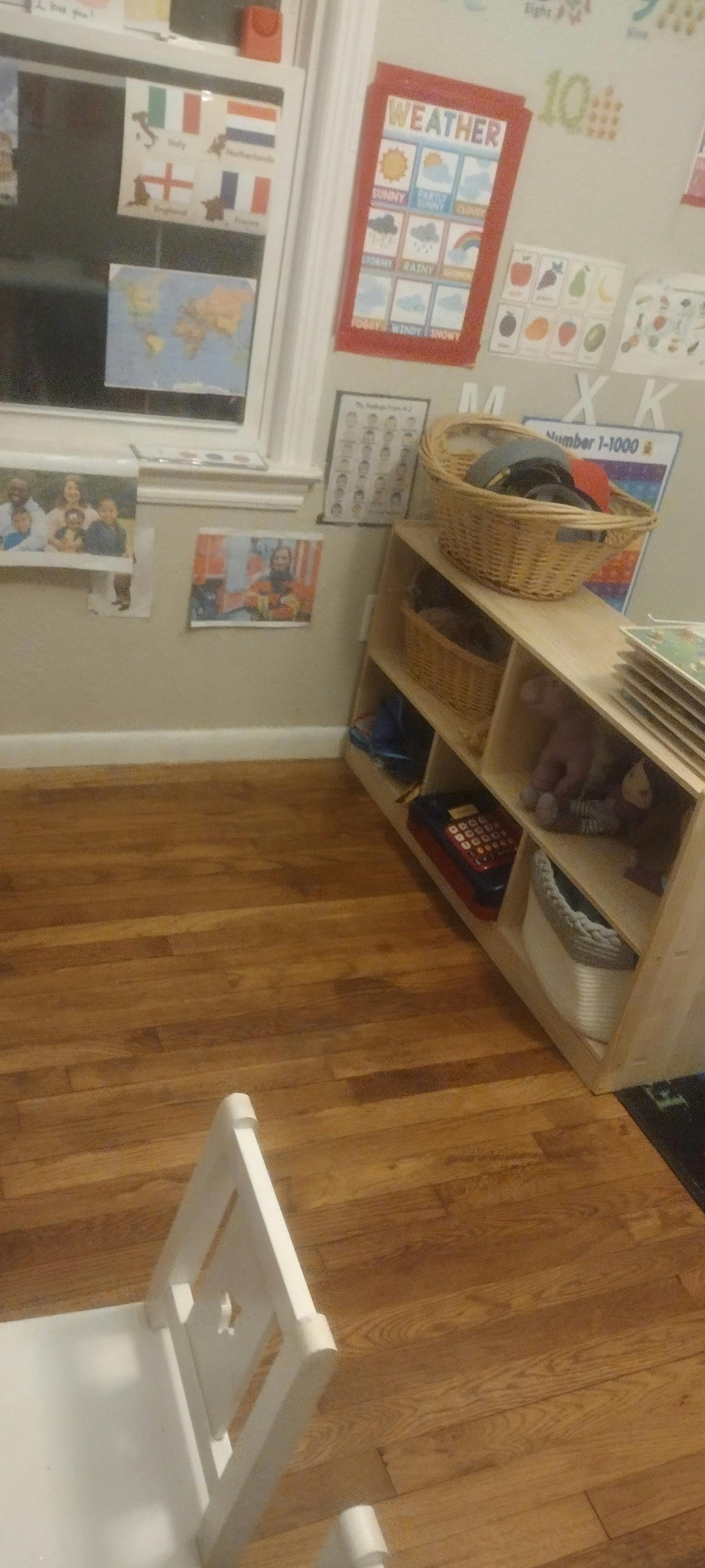 children's classroom with weather chart and storage cubbies