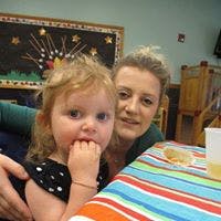 Adult and child at a table