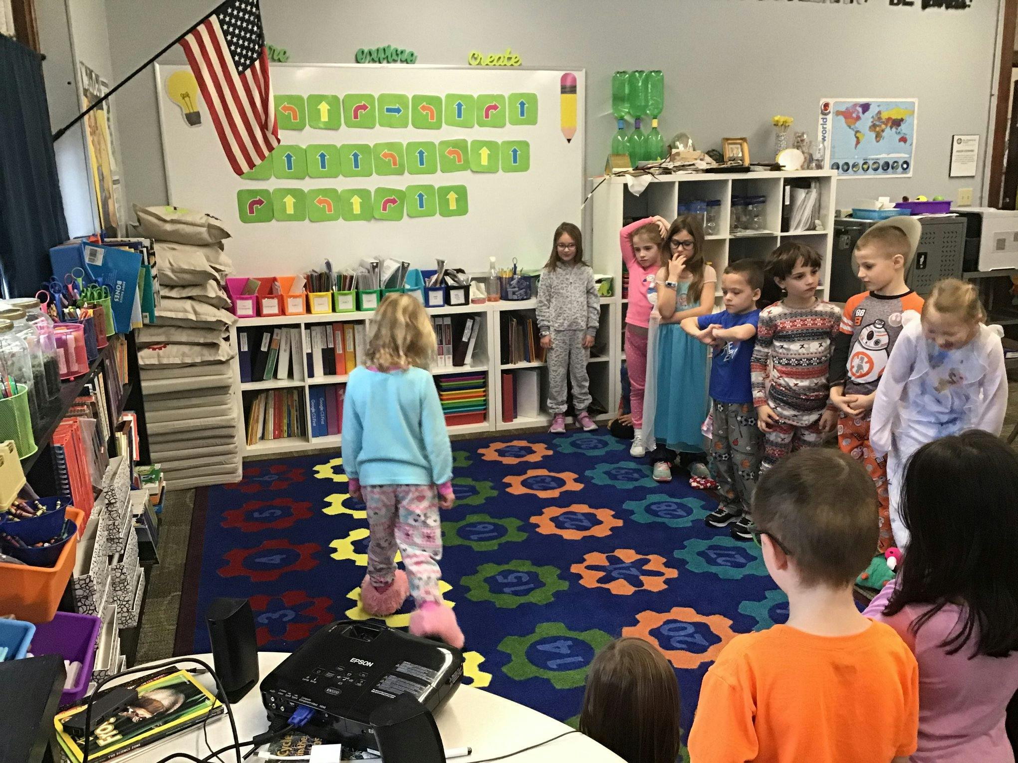 Children standing in a classroom