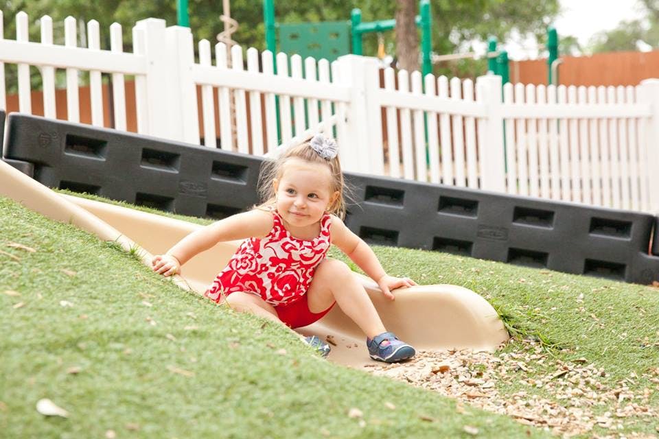 Child on a playground slide
