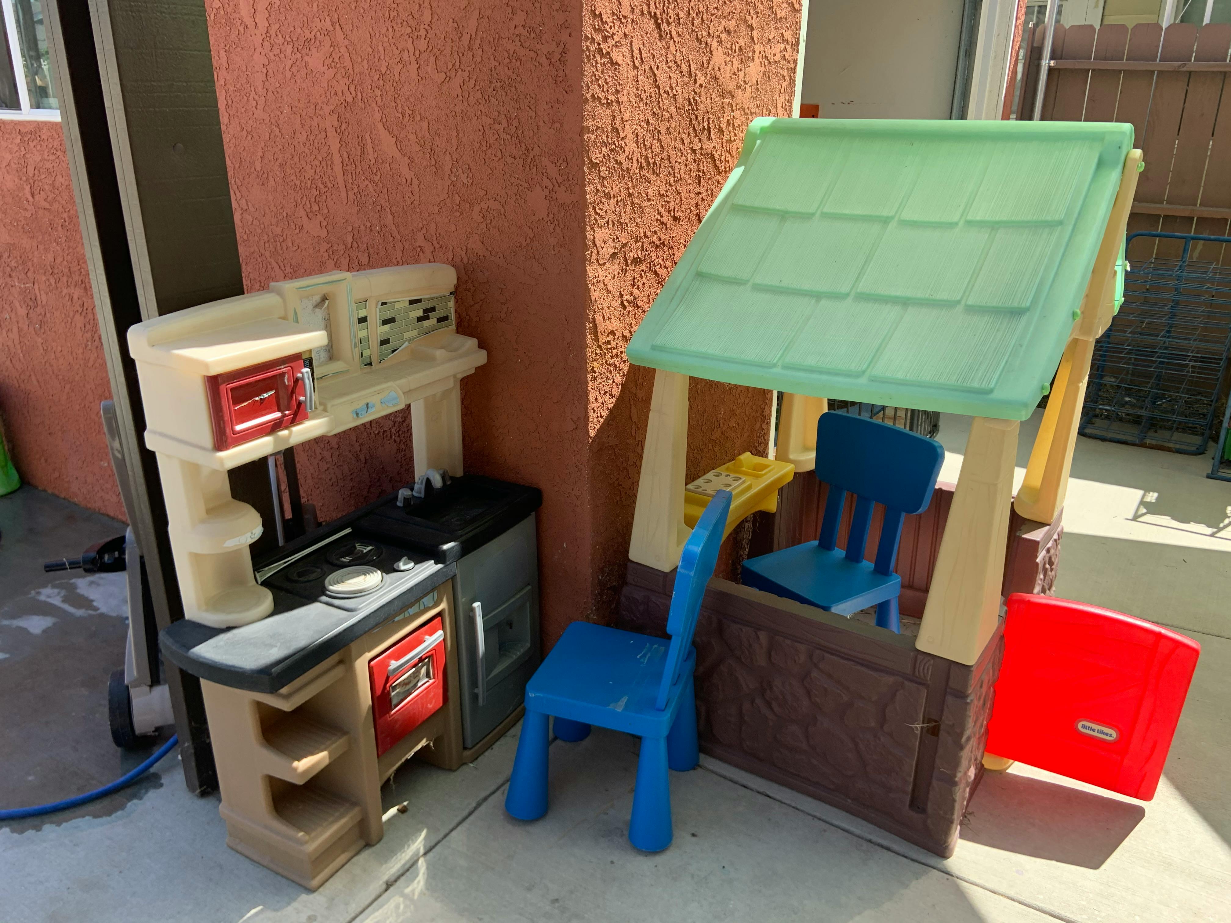 Play kitchen and playhouse with blue chairs