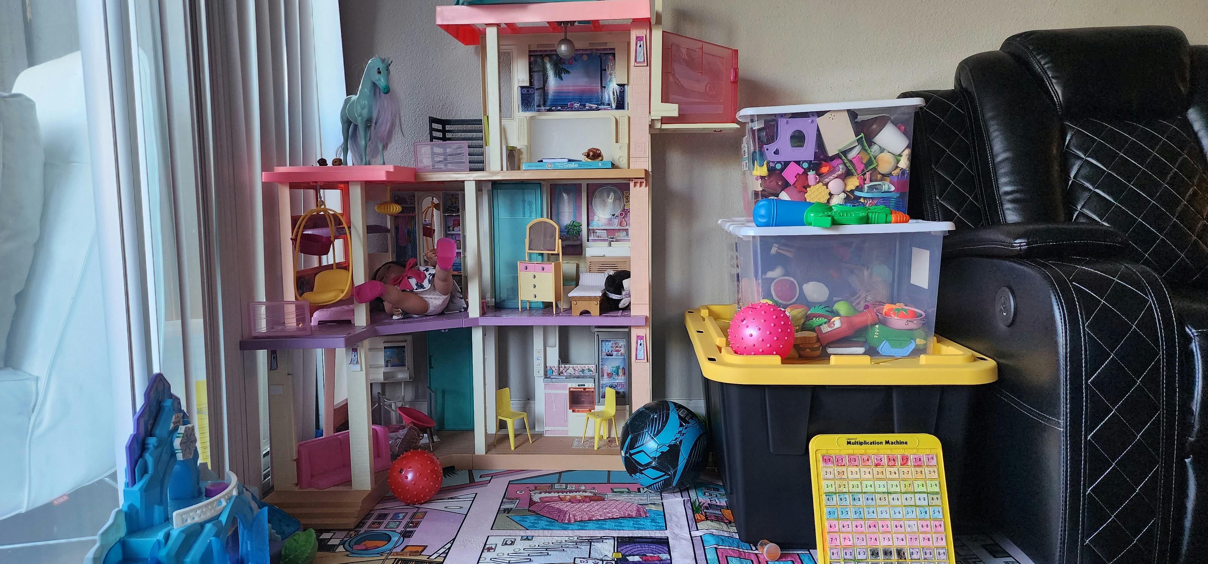 Dollhouse with toys and storage containers