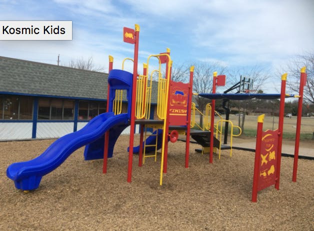 Playground with blue slide and red and yellow climbing structures