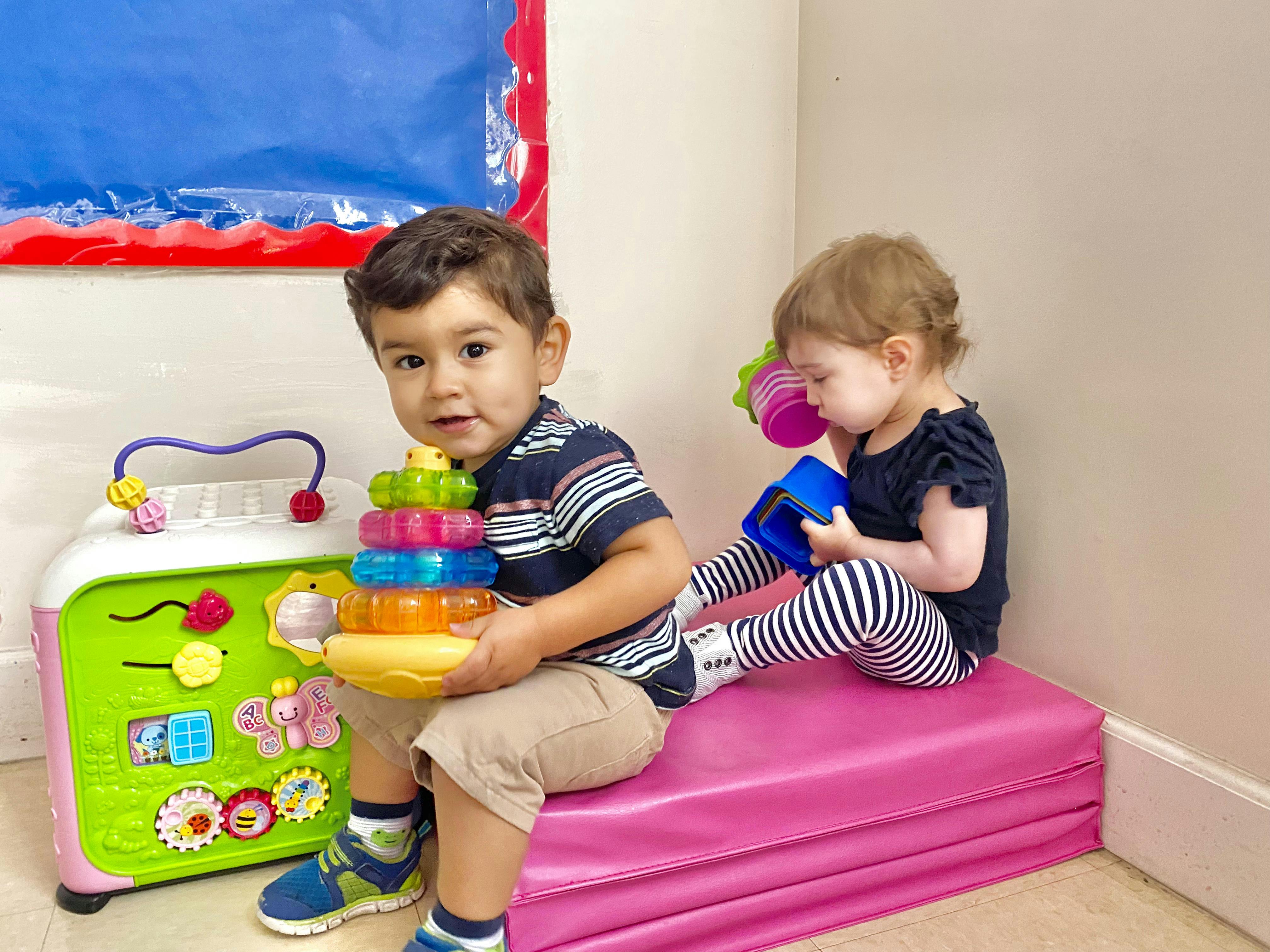 Two children playing with toys