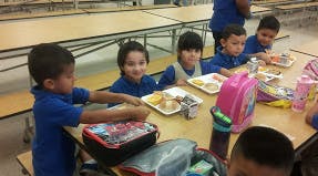 Children eating lunch at a table