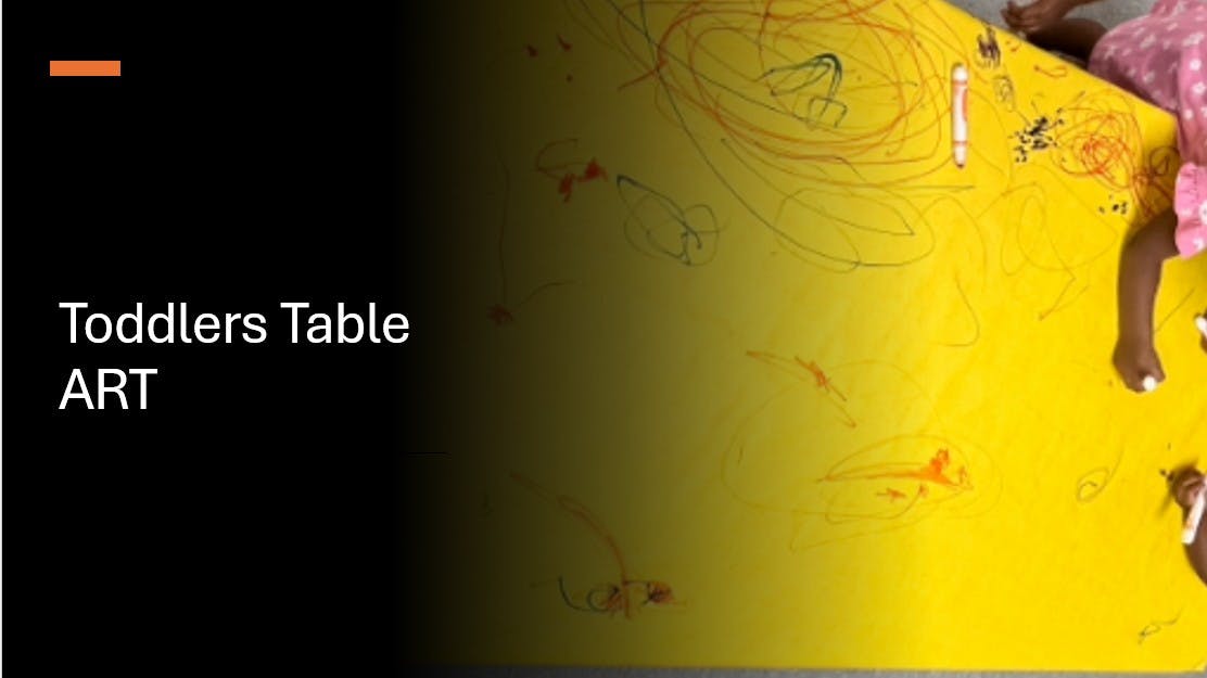 Child sitting at a yellow table with drawings and art supplies