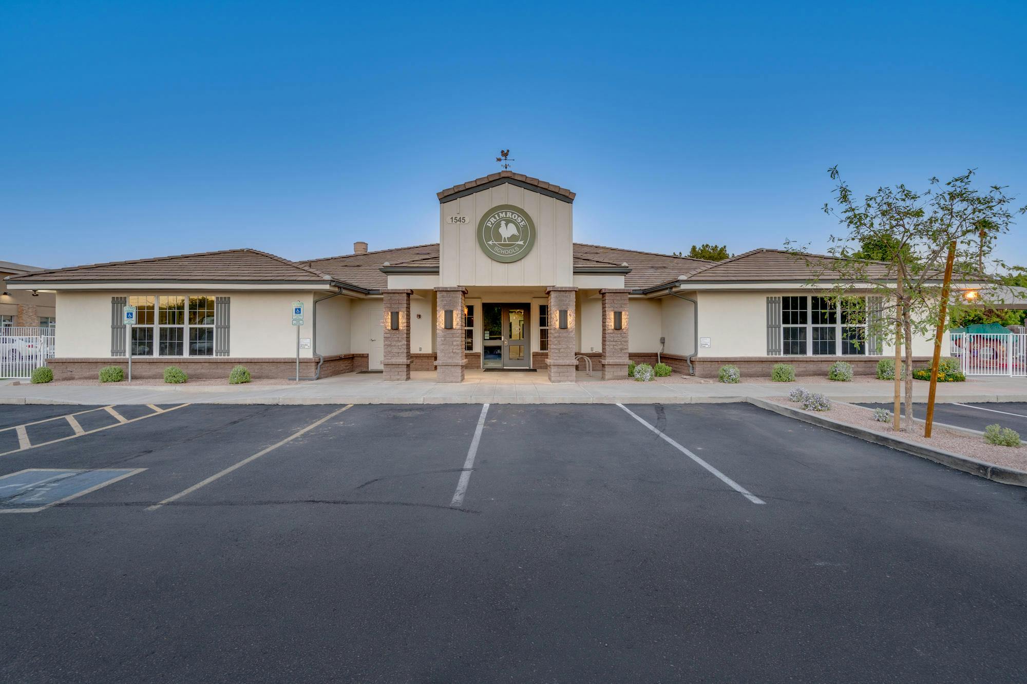 Building exterior with a parking lot in front