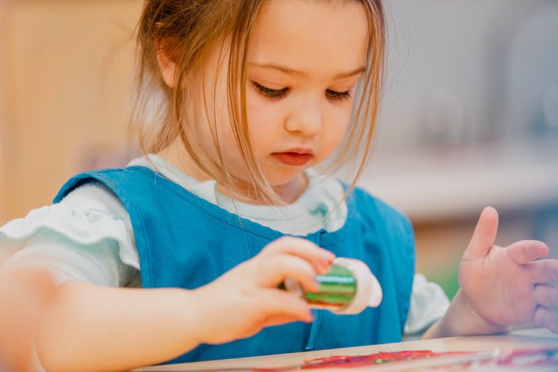 Child holding a small object