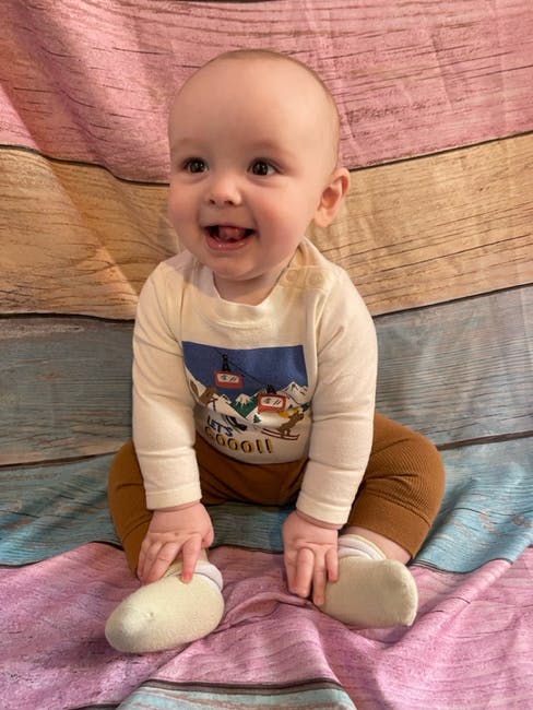 Child sitting and smiling