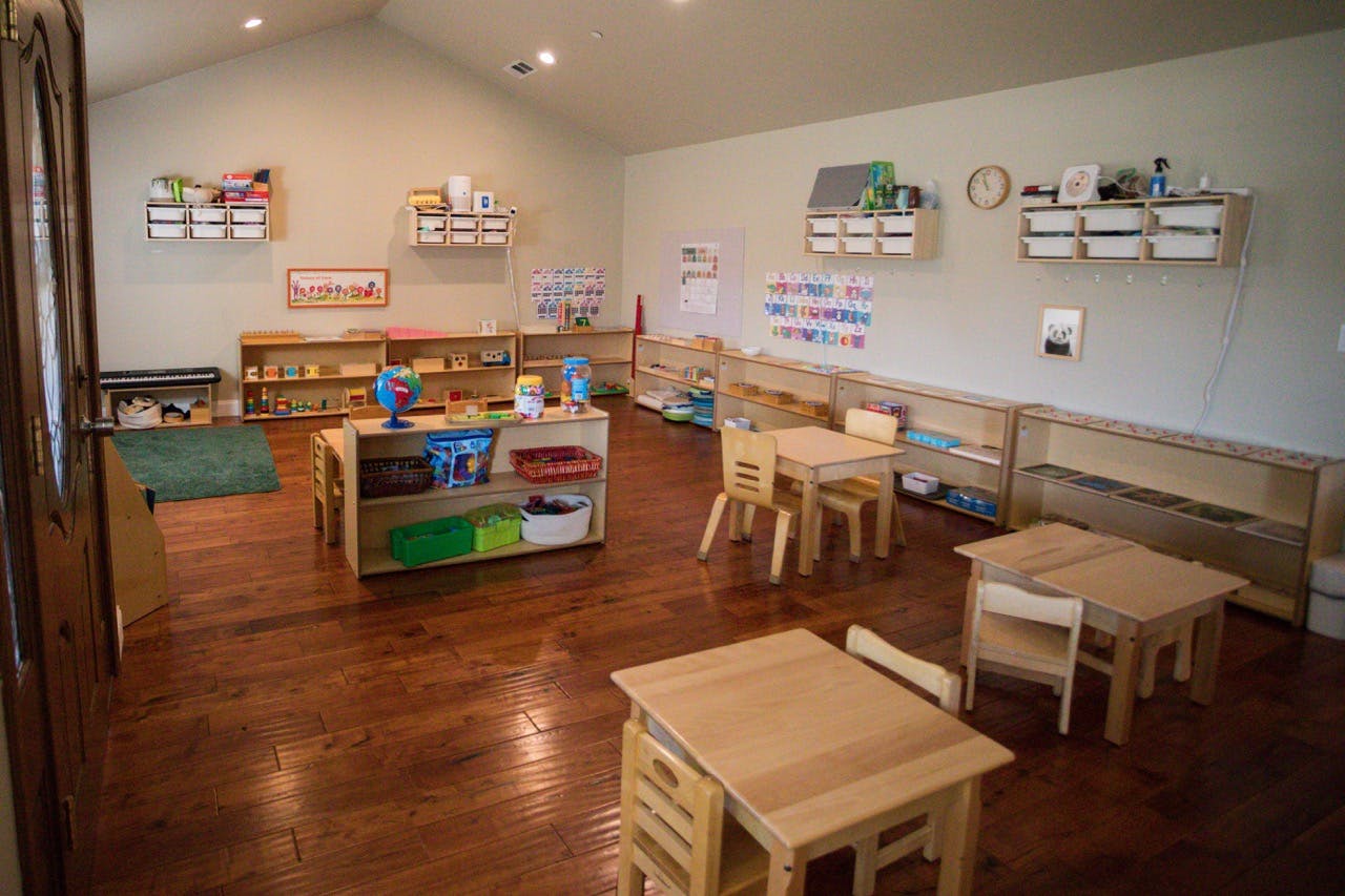 Classroom interior with small tables and chairs for children