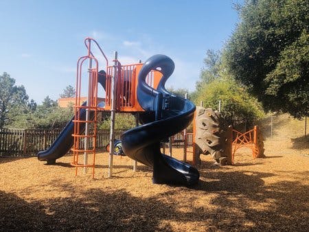 Playground with slides and climbing structure