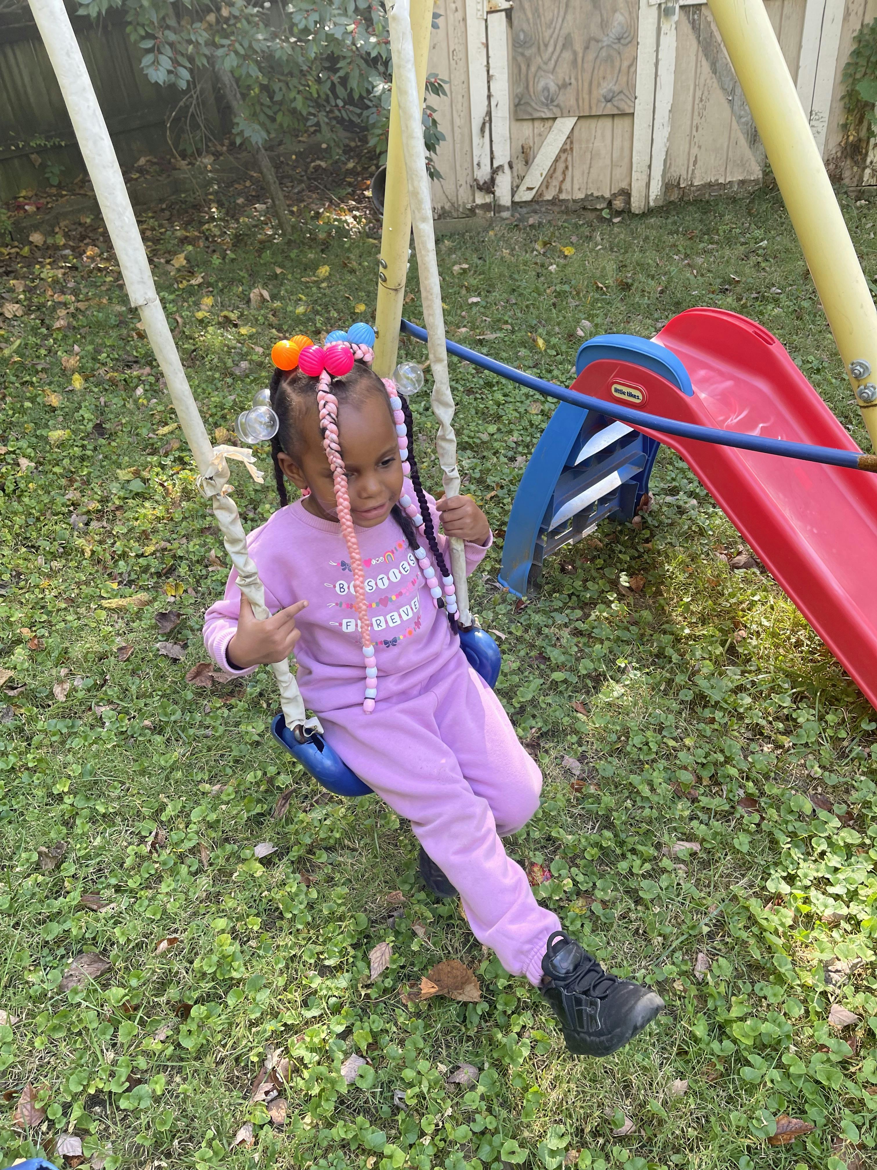 Child on a swing set