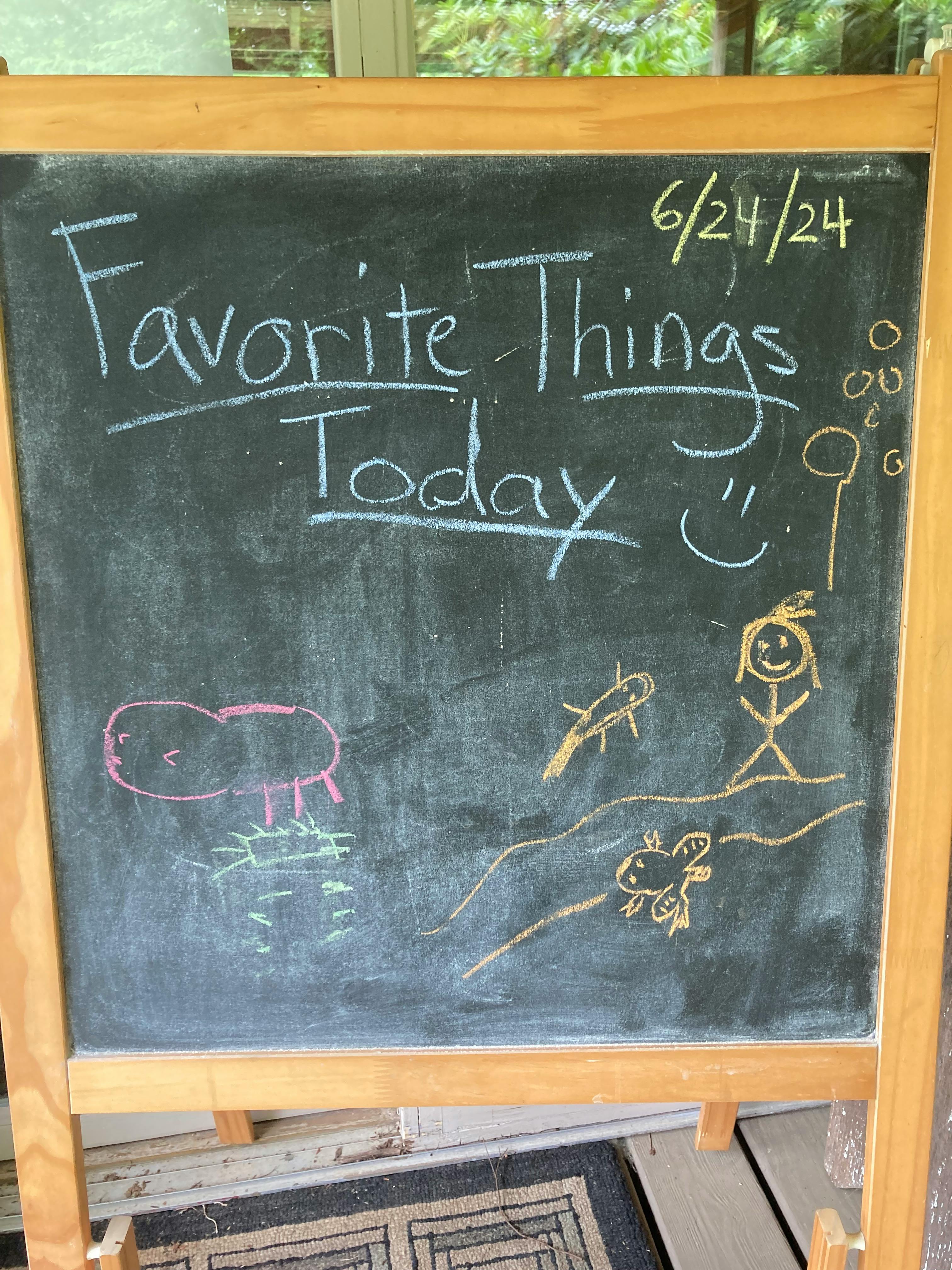 Chalkboard with "Favorite Things Today" and child-like drawings