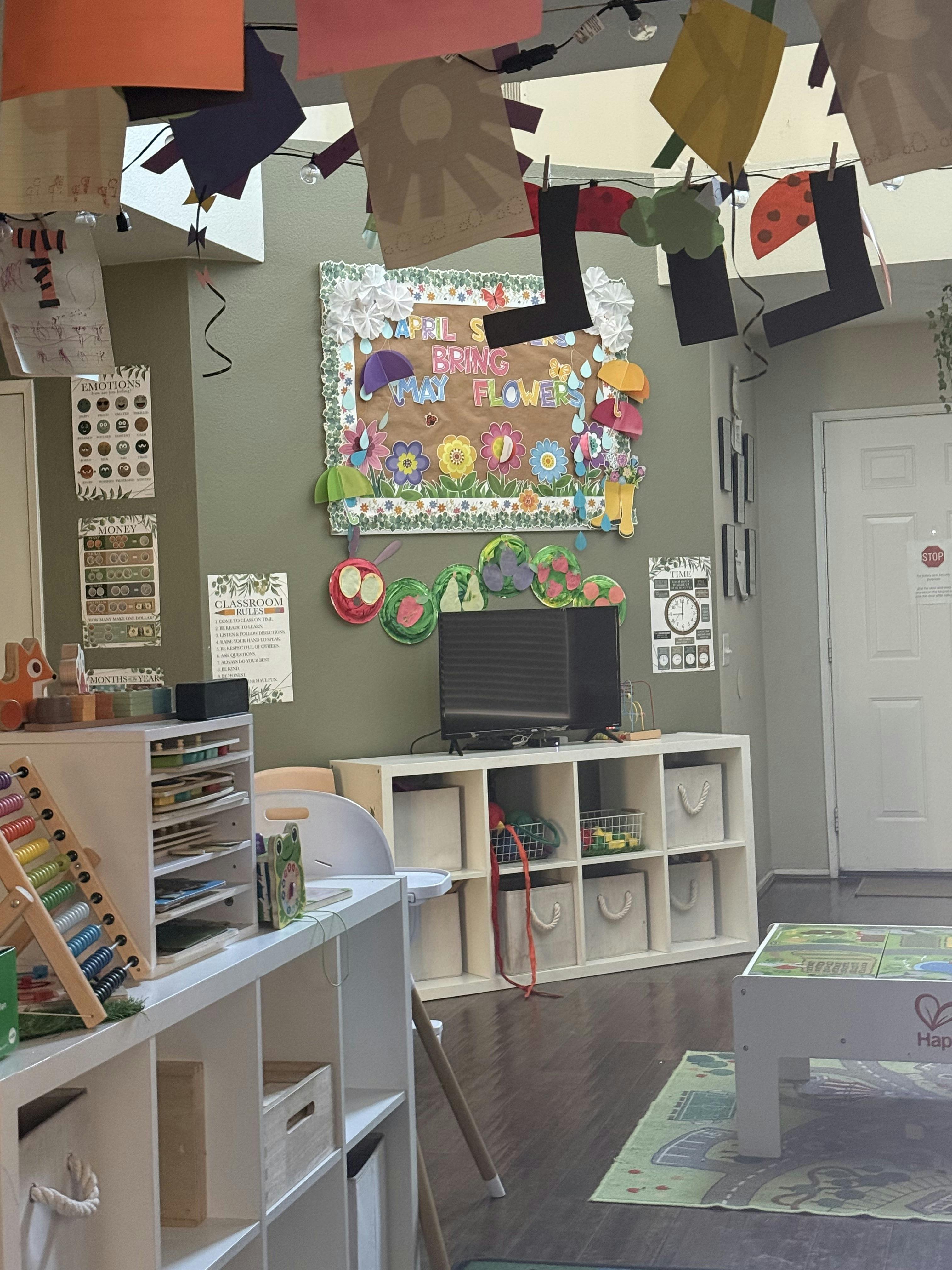 Classroom interior with educational wall displays and shelves