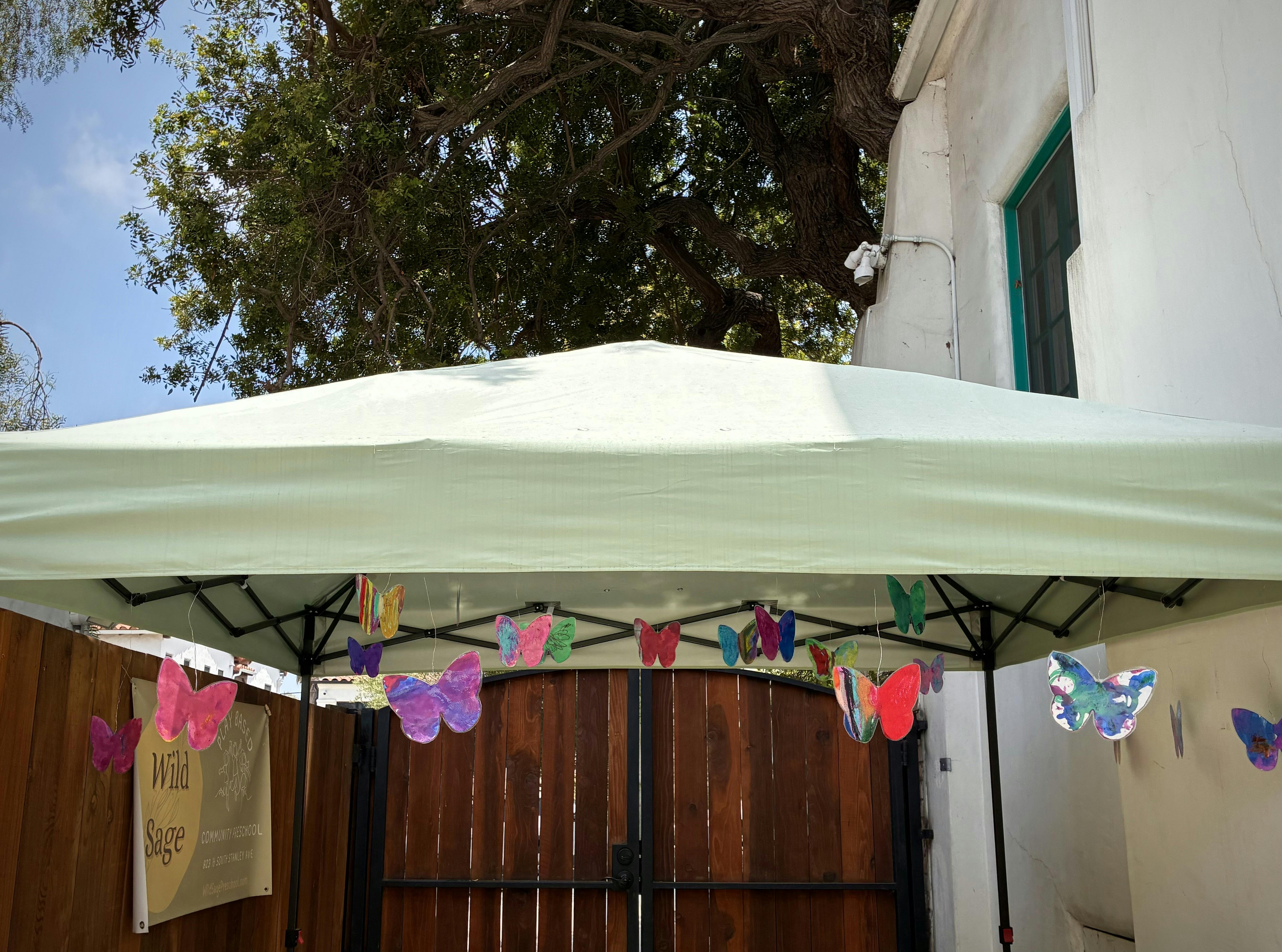 Paper butterfly decorations hanging from a canopy