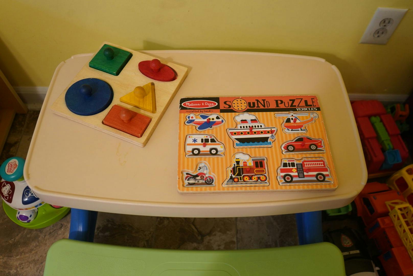 Two wooden puzzles on a child's table