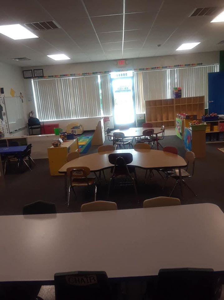 Empty classroom with tables and chairs