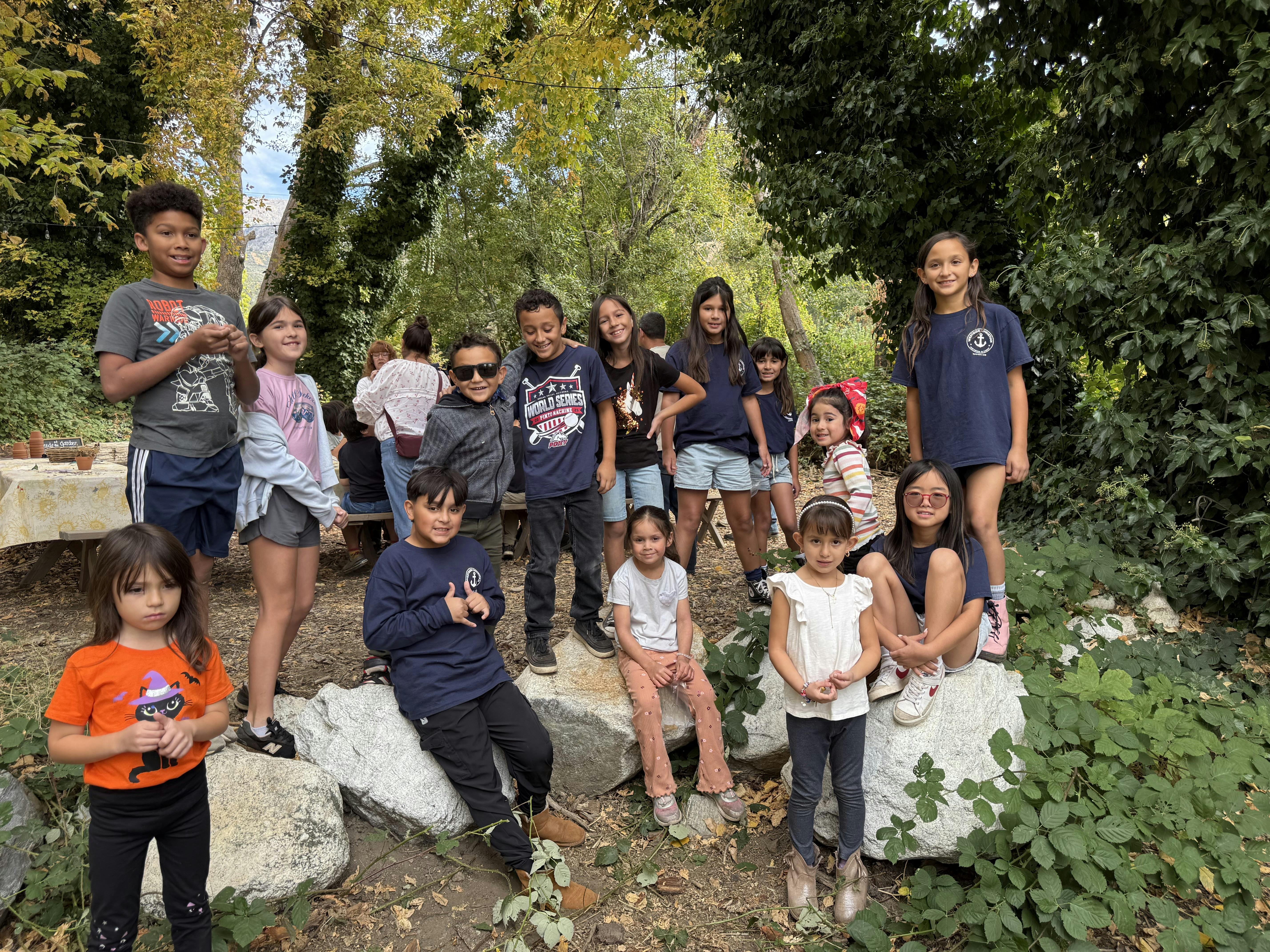 Group of children and teens posing outdoors