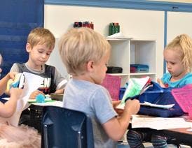 Children doing crafts at a table