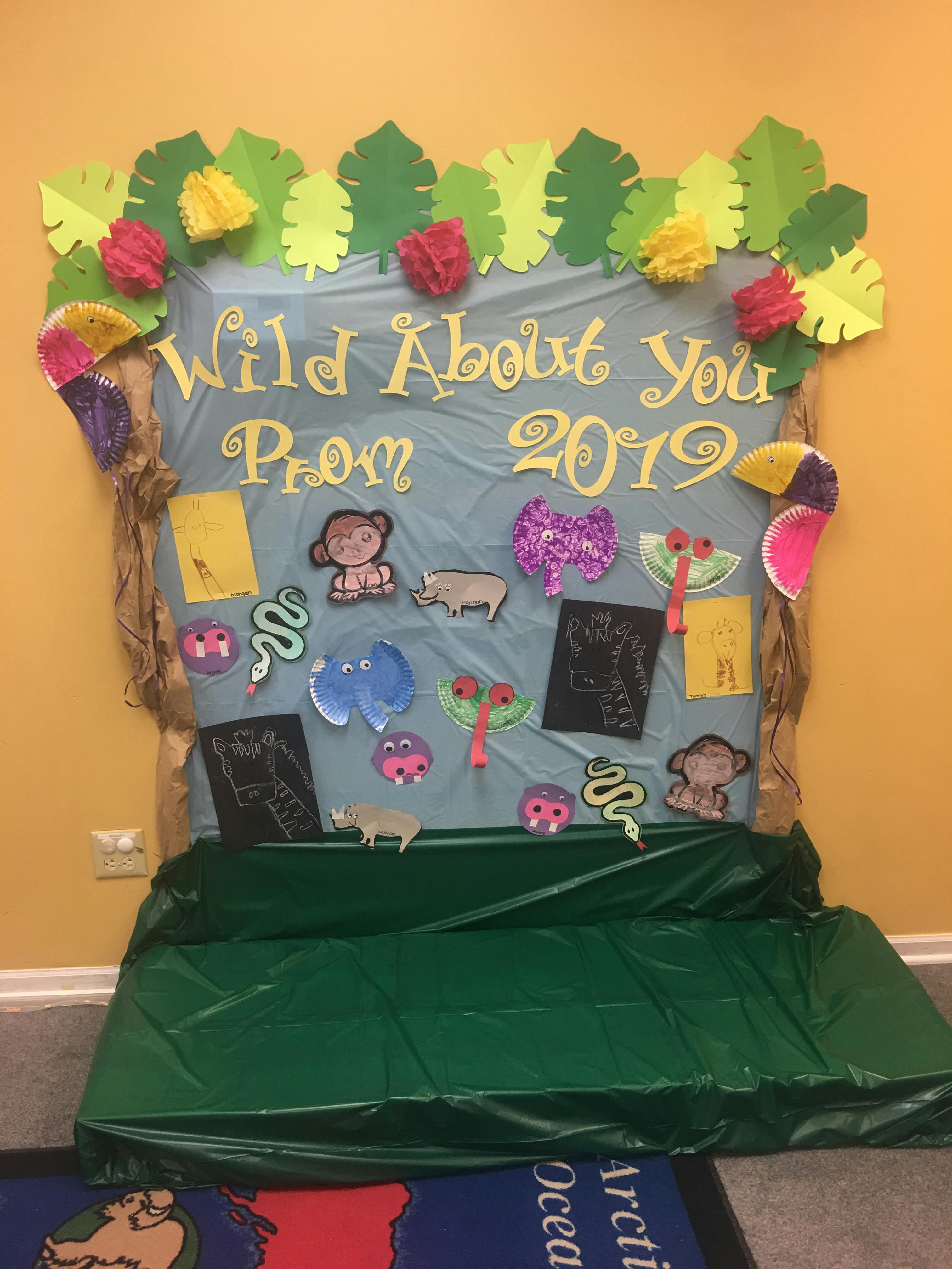 Prom 2019 sign with "Wild About You" and jungle animal cutouts