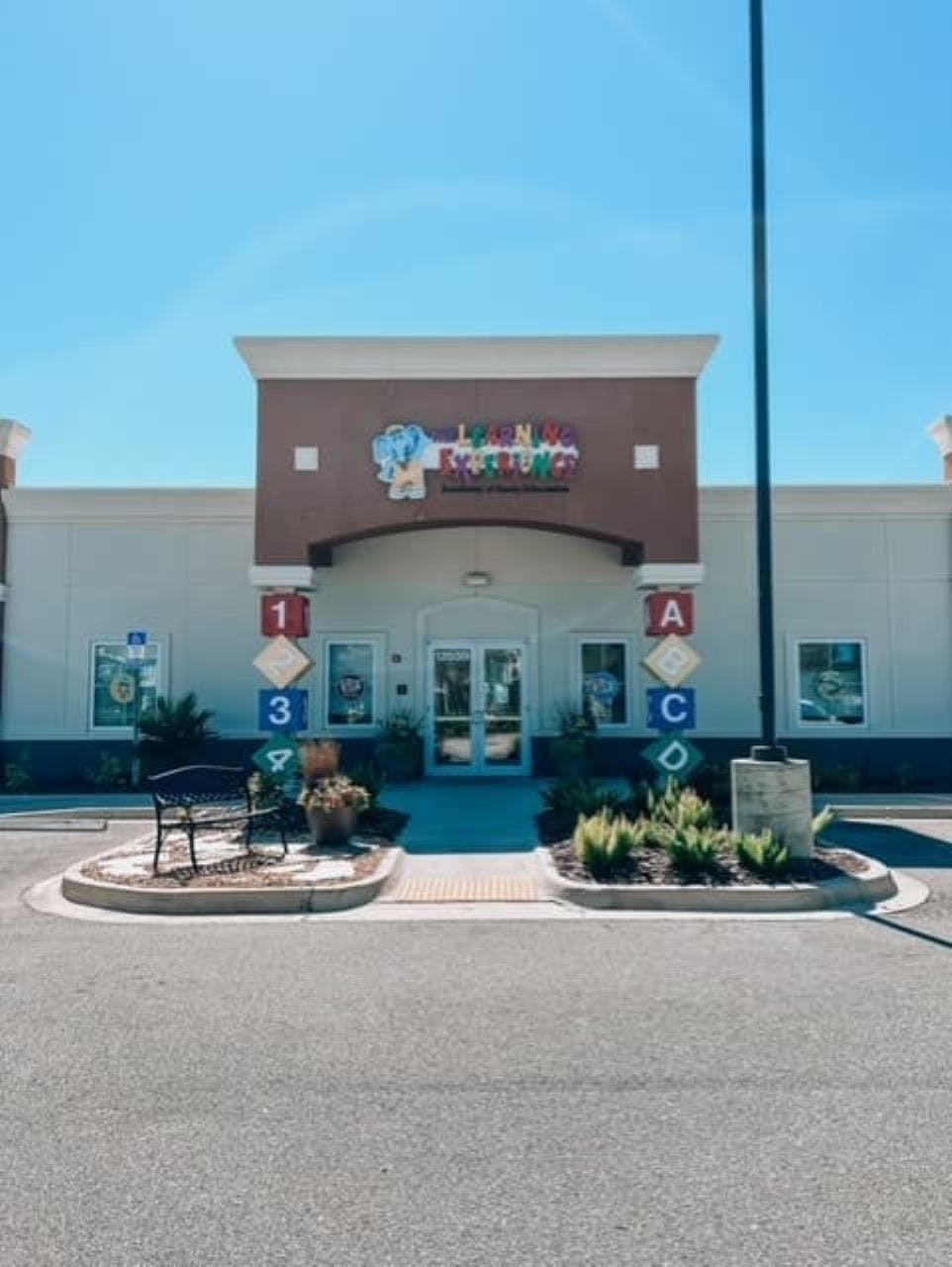Building with a sign that reads "Children's Academy"