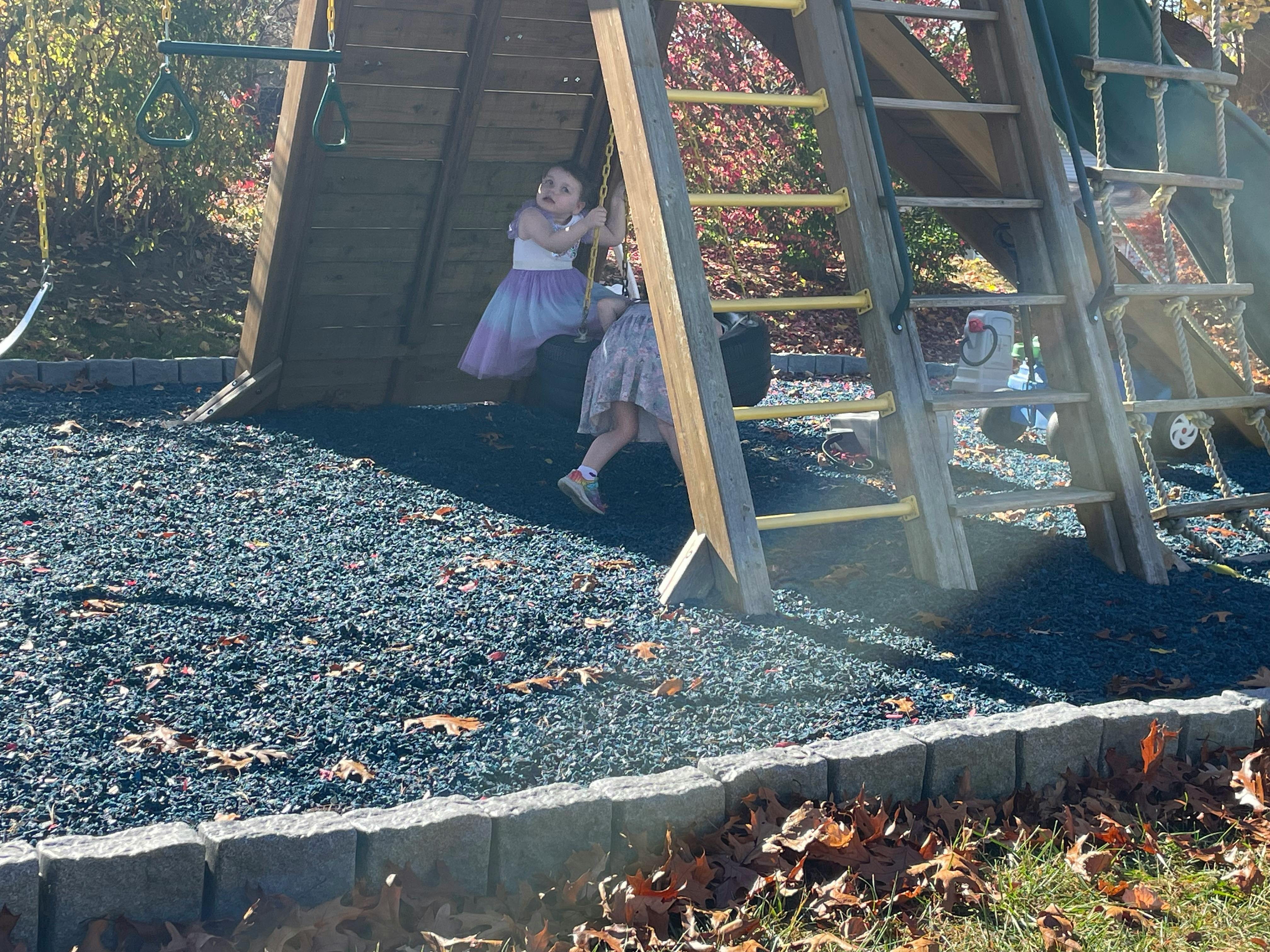 Two children on a playground structure