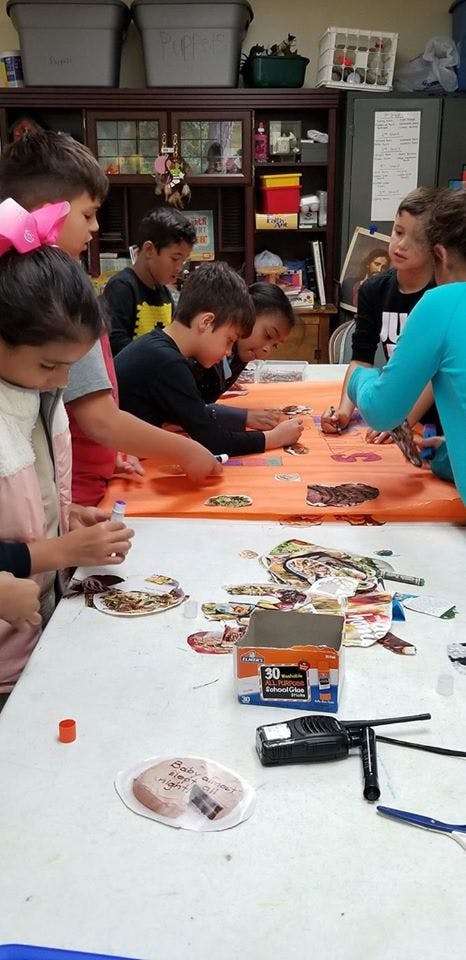 Children working on crafts at a table