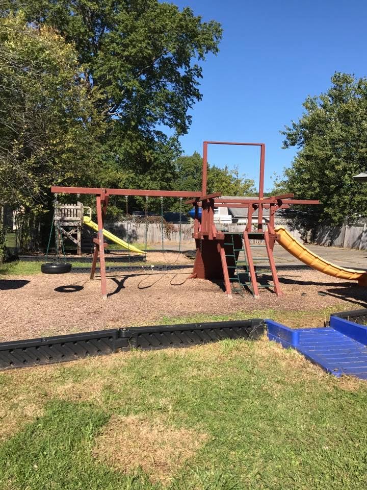 Outdoor playground with swings and slides