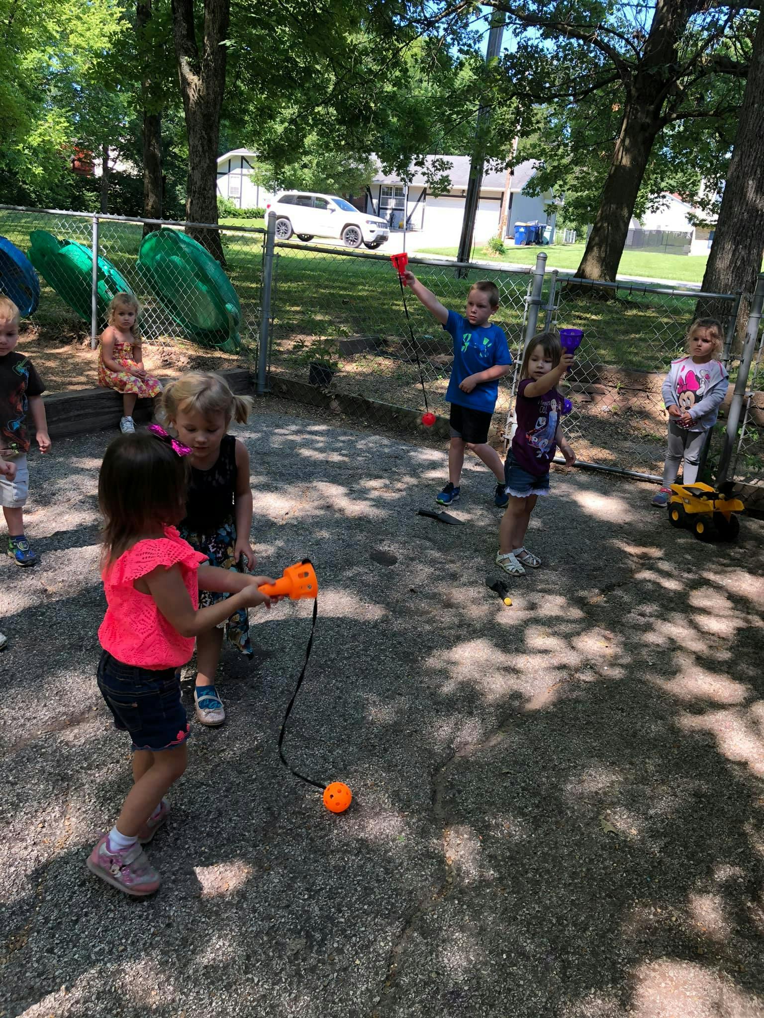 Children playing with toys outdoors
