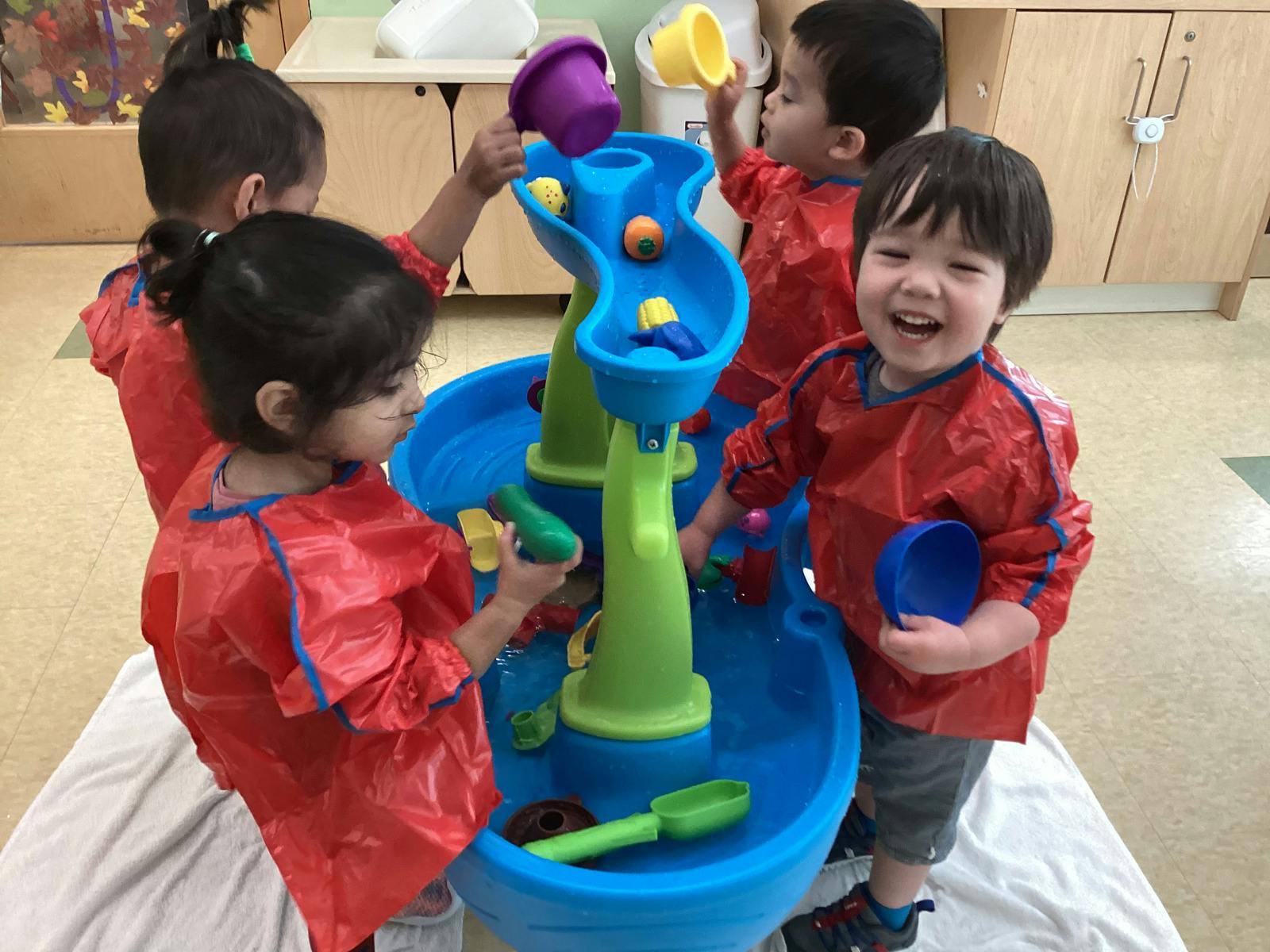 Children playing with a water table