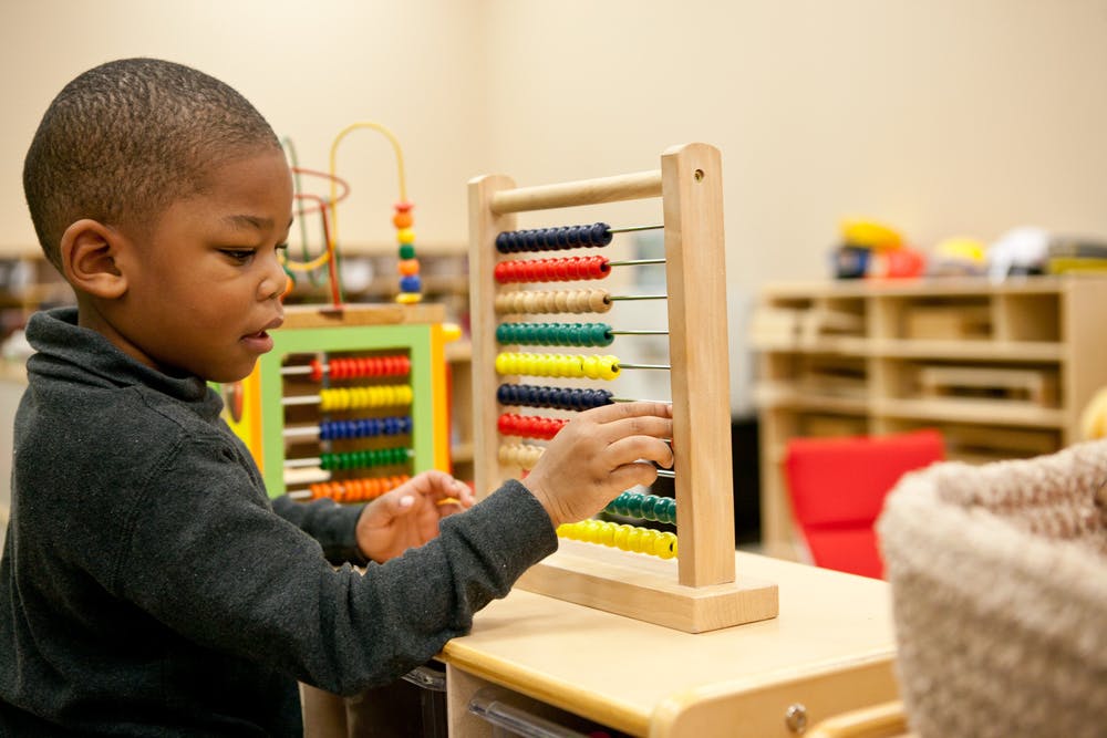 Child playing with an abacus