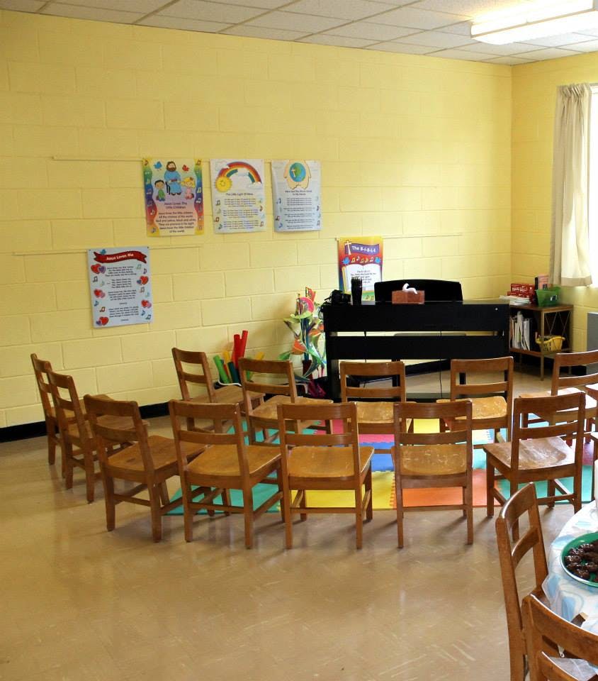 Empty chairs arranged in a circle in a classroom
