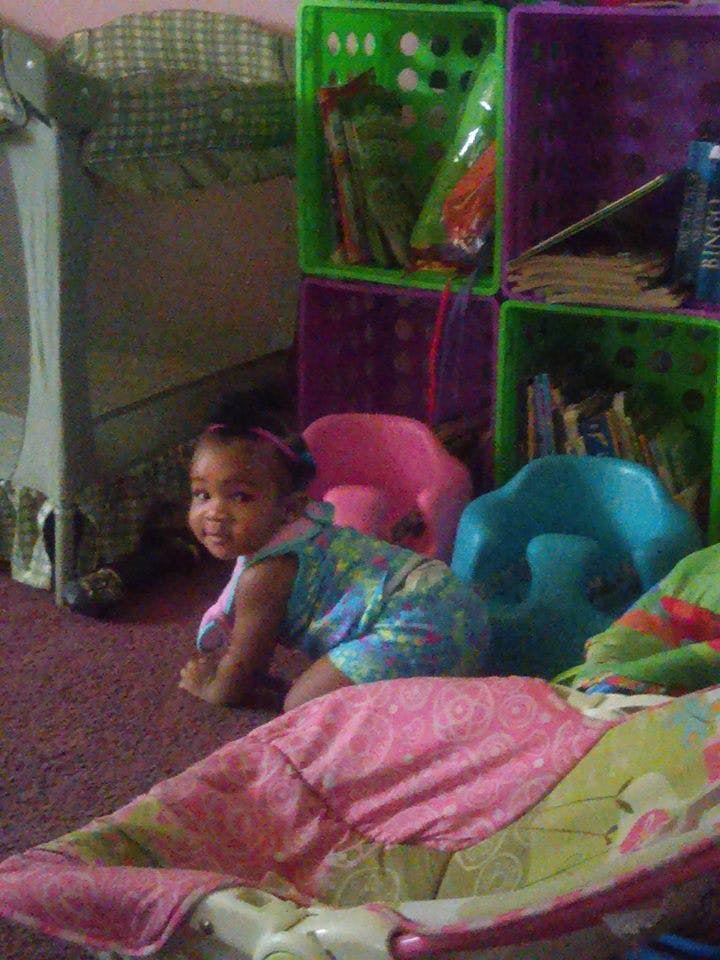 Child crawling on a carpeted floor