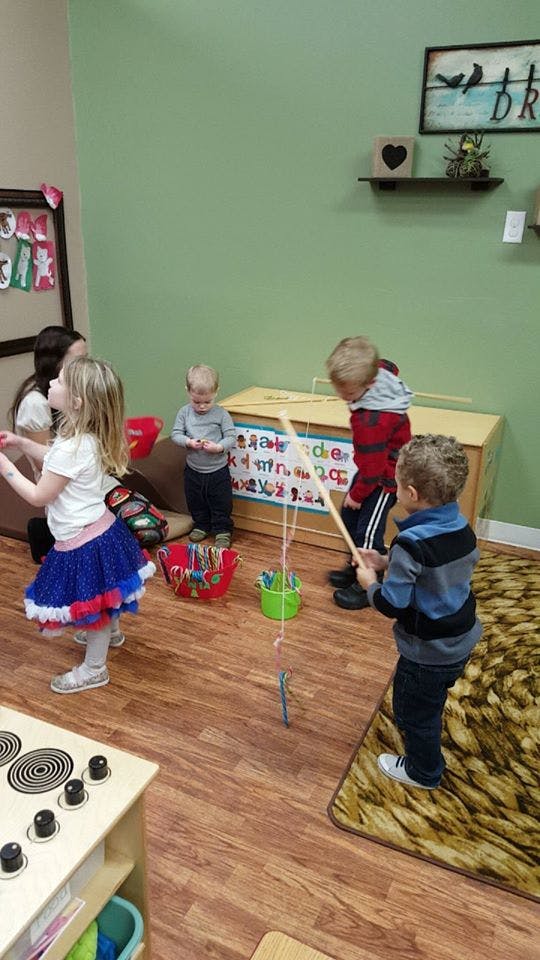 Children playing with toys in a room