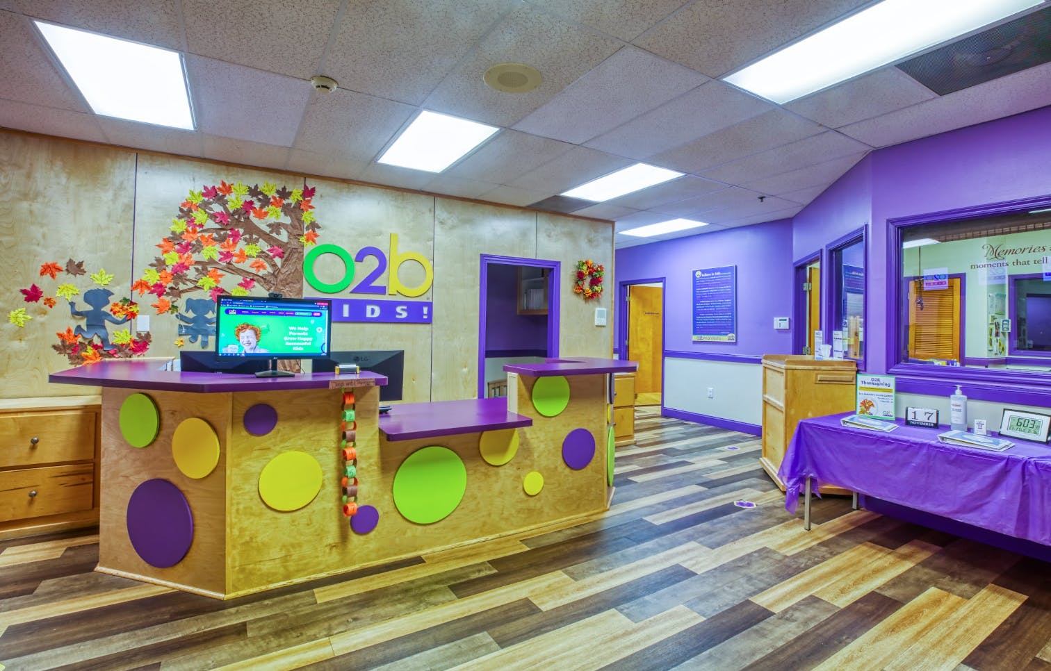 Reception desk with computer and O2B Kids! logo